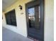 Exterior shot of the entry door and window of the residence at 1003 Hammock Pine Blvd # 1003, Clearwater, FL 33761