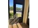 Screened lanai with view of street and landscaping at 1003 Hammock Pine Blvd # 1003, Clearwater, FL 33761
