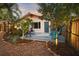 Cozy backyard deck with seating and mature landscaping at 1166 Granada St, Clearwater, FL 33755