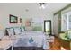 Spacious bedroom with hardwood floors, sea-themed bedding, and bright windows at 1166 Granada St, Clearwater, FL 33755