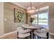 Cozy breakfast nook features a stylish light fixture, modern wallpaper and sliding glass doors to the patio at 1221 Hillandale Reserve Dr, Tampa, FL 33613