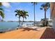 An outdoor deck with scenic waterfront views, perfect for relaxing by the water at 14105 E Parsley Dr, Madeira Beach, FL 33708