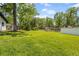 Large backyard featuring ample green space enclosed by a chain-link fence at 1520 Arnold Ave, Brooksville, FL 34601