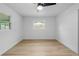 Bright bedroom with neutral paint and flooring, ready for your personal touch and decor at 1520 Arnold Ave, Brooksville, FL 34601