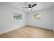 Bright bedroom with natural light, ceiling fan, and neutral decor at 1520 Arnold Ave, Brooksville, FL 34601