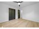 Bedroom with a closet, neutral paint, ceiling fan and wood floors at 1520 Arnold Ave, Brooksville, FL 34601