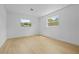 Bright bedroom with two windows offering natural light and views of the outdoors at 1520 Arnold Ave, Brooksville, FL 34601