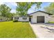Inviting home featuring a well-manicured lawn and an attached one-car garage, blending comfort with curb appeal at 1520 Arnold Ave, Brooksville, FL 34601