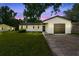 Charming home featuring a well-maintained lawn and a one-car garage, perfect for suburban living at 1520 Arnold Ave, Brooksville, FL 34601