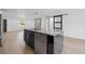 Kitchen island with marble countertop and stainless steel dishwasher at 1520 Arnold Ave, Brooksville, FL 34601