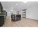 Modern open-concept kitchen with a central island featuring marble countertops and leading into living room at 1520 Arnold Ave, Brooksville, FL 34601