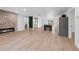 Bright and airy living space with wood floors, a modern fireplace, and sliding door access to the backyard at 1520 Arnold Ave, Brooksville, FL 34601