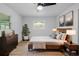 Comfortable main bedroom with a large bed, dresser, and tasteful decorations at 1520 Arnold Ave, Brooksville, FL 34601