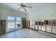 Bright living room with sliding glass door access to the outdoor waterfront patio at 212 176Th Terrace E Dr, Redington Shores, FL 33708