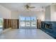 Bright living room features a fireplace, and large sliding glass doors to the waterfront at 212 176Th Terrace E Dr, Redington Shores, FL 33708