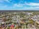 Aerial shot of a neighborhood featuring quaint homes, lush green trees, and a neatly organized layout at 2713 W Osborne Ave, Tampa, FL 33614
