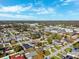 High-angle view of a neighborhood showcasing rooftops, tree canopies, and the surrounding community at 2713 W Osborne Ave, Tampa, FL 33614