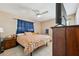 Comfortable bedroom with tile floors and a ceiling fan at 2713 W Osborne Ave, Tampa, FL 33614
