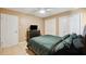 Bedroom featuring neutral paint, tile floors, ceiling fan and closet at 2713 W Osborne Ave, Tampa, FL 33614