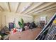 Cluttered garage with storage solutions, tools, and equipment, offering ample space for projects and organization at 2713 W Osborne Ave, Tampa, FL 33614