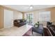 Inviting living room showcases neutral paint, tile floors, and access to the outdoors at 2713 W Osborne Ave, Tampa, FL 33614