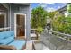 Relaxing balcony featuring a cozy seating area with a stylish glass-top table, perfect for enjoying outdoor living at 337 4Th S Ave, St Petersburg, FL 33701