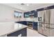 Modern kitchen featuring stainless steel appliances, blue cabinets and bright white countertops at 337 4Th S Ave, St Petersburg, FL 33701