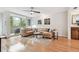 Bright living room with hardwood floors, neutral decor, and a large window providing natural light at 337 4Th S Ave, St Petersburg, FL 33701