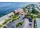 Stunning aerial view of a waterfront community featuring a pink clubhouse, docks, and lush landscaping by the bay at 4744 Snook Se Dr, St Petersburg, FL 33705