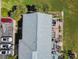 Aerial view of condos with well-maintained roofs, patios, and ample parking at 4744 Snook Se Dr, St Petersburg, FL 33705