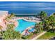 A captivating community pool and a beautiful backdrop of the water and sky at 4744 Snook Se Dr, St Petersburg, FL 33705