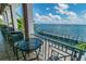 Balcony view of waterfront with tables and chairs overlooking the water and dock area at 4744 Snook Se Dr, St Petersburg, FL 33705