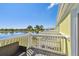 Balcony featuring outdoor seating and scenic views of a lake and lush landscape at 4744 Snook Se Dr, St Petersburg, FL 33705