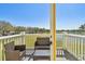 Cozy balcony with seating and a view of a lake at 4744 Snook Se Dr, St Petersburg, FL 33705