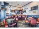 Inviting bar area with ample seating, flat-screen TVs, and nautical-themed accents at 4744 Snook Se Dr, St Petersburg, FL 33705