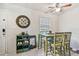 Cozy dining area with tile floors, a ceiling fan, and a view to the front door at 4744 Snook Se Dr, St Petersburg, FL 33705