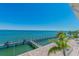 Panoramic view of the beautiful dock stretching over the turquoise ocean water at 4744 Snook Se Dr, St Petersburg, FL 33705