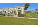 Beautiful condo exterior with well-maintained lawn, landscaping, and private patios at 4744 Snook Se Dr, St Petersburg, FL 33705