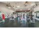 Full gym with up-to-date equipment, ceiling fans, and modern lighting for a comfortable workout environment at 4744 Snook Se Dr, St Petersburg, FL 33705