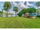 Kayaks stored on a rack on a grassy area in the community by the water at 4744 Snook Se Dr, St Petersburg, FL 33705