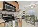 Well-lit kitchen with a view to the dining area at 4744 Snook Se Dr, St Petersburg, FL 33705