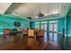 Inviting lounge area with comfortable seating, ceiling fans, wood floors and French doors at 4744 Snook Se Dr, St Petersburg, FL 33705