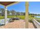 Cozy covered patio offering picturesque views of the lake at 4744 Snook Se Dr, St Petersburg, FL 33705