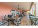 Spacious covered patio with seating and ceiling fans, perfect for outdoor relaxation and entertaining at 4744 Snook Se Dr, St Petersburg, FL 33705