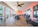 Spacious outdoor patio with comfortable seating, ceiling fans, and scenic views at 4744 Snook Se Dr, St Petersburg, FL 33705