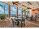 Outdoor patio area with a beautiful ocean view, ceiling fans, and comfortable seating at 4744 Snook Se Dr, St Petersburg, FL 33705
