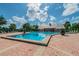 Relax by the sparkling pool with ample seating and lush tropical landscaping at 4744 Snook Se Dr, St Petersburg, FL 33705