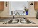 Kitchen sink with granite countertops and pass-through to another room at 4744 Snook Se Dr, St Petersburg, FL 33705