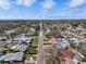 Wide aerial view of a residential neighborhood with tree-lined streets and tidy homes at 5559 17Th N Ave, St Petersburg, FL 33710