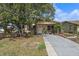 Charming brick home featuring a well-manicured lawn and welcoming front entrance at 5559 17Th N Ave, St Petersburg, FL 33710